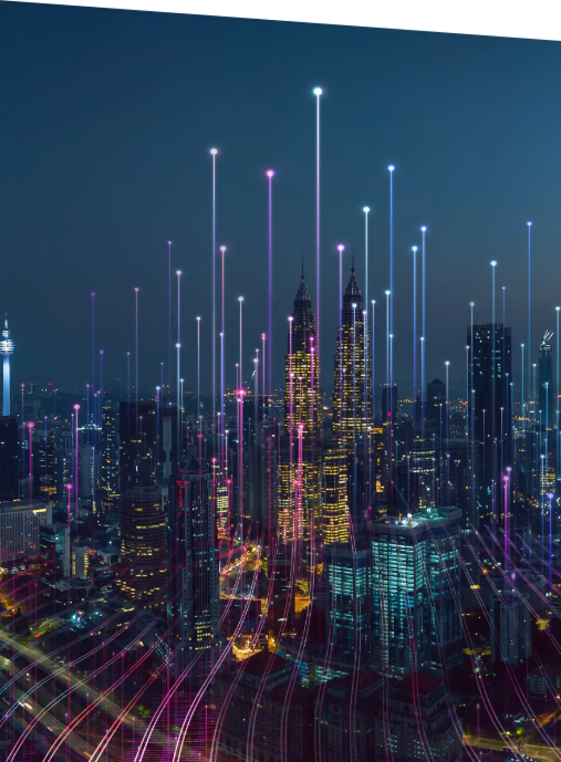 Nighttime city skyline with abstract, colorful neon lines floating in the sky to represent data points and technology.